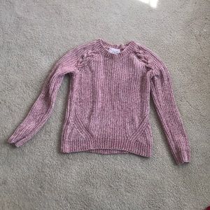 A pink, knit, metallic sweater